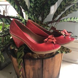 Red, patent leather, peep-toe heels with flower